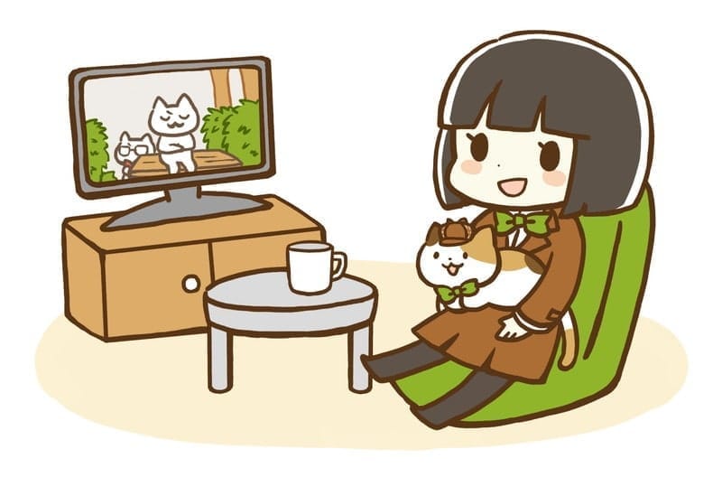 テレビを見ている女の子と猫